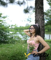 adorable asian girl posing in her sexy top and tight jeans outdoors3277