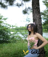 adorable asian girl posing in her sexy top and tight jeans outdoors3280