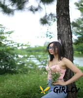 adorable asian girl posing in her sexy top and tight jeans outdoors3281