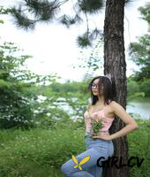 adorable asian girl posing in her sexy top and tight jeans outdoors3282