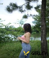adorable asian girl posing in her sexy top and tight jeans outdoors3265