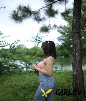 adorable asian girl posing in her sexy top and tight jeans outdoors3284