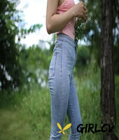 adorable asian girl posing in her sexy top and tight jeans outdoors3271