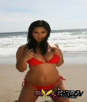 irresistible pornstar and model sunny leone in sexy red swim suit on the beach16643