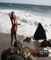 irresistible pornstar and model sunny leone in sexy red swim suit on the beach16649