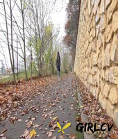 white girl claudia macc takes a piss on fallen leaves near a sports park 70061399