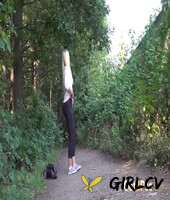 blonde girl delphine takes a pee on a dirt path near some greenery