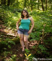 saucy american raven snow spreads her very hairy pussy naked in the woods