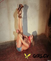 topless blonde slave girl in jean shorts and heels posing bound on the floor48416