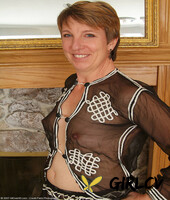 short-haired lady embers strips by the fireplace and rubs her furry cunt57100