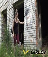 solo girl diana sweet takes a piss in the entrance to an abandoned building101903
