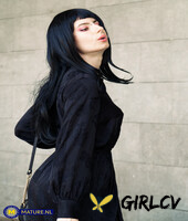 raven-haired woman poses in her sexy black outfit and boots in public153338