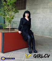 raven-haired woman poses in her sexy black outfit and boots in public153342
