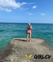 middle-aged blonde sweet susi releases her natural tits and twat from a bikini