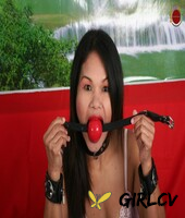asian girl inserts a big ball gag while partaking in self bondage play43880