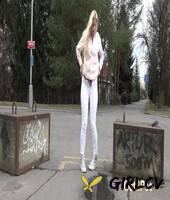 natural blonde katy sky takes a piss on a paved road during the day209971