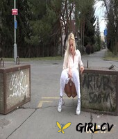natural blonde katy sky takes a piss on a paved road during the day209960