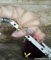 redheaded fatty slavegirl emma gets bound to a metal bdsm construction212066
