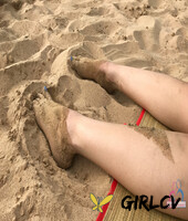 amateur girlfriend liza rowe poses in her sexy bikini on a sandy beach