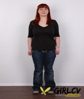 redhead plumper maja takes a seat after stripping naked afore a wall121322