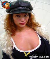 redhead bellamaria sucks off a black cock through a gloryhole in a washroom