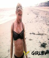 sexy blonde abby marie flaunts her incredible ass in black undies on the beach210143