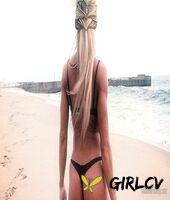 sexy blonde abby marie flaunts her incredible ass in black undies on the beach210150