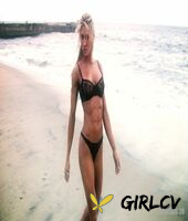 sexy blonde abby marie flaunts her incredible ass in black undies on the beach210139