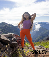 latina irene rouse poses in her yoga pants & shirt on a mountian top103290