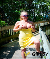 blonde lady wendy shows her round tits while going nude in the ocean