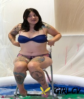 amateur lesbians douse each other in gunk while in a wading pool