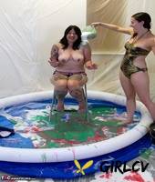 amateur lesbians douse each other in gunk while in a wading pool35177